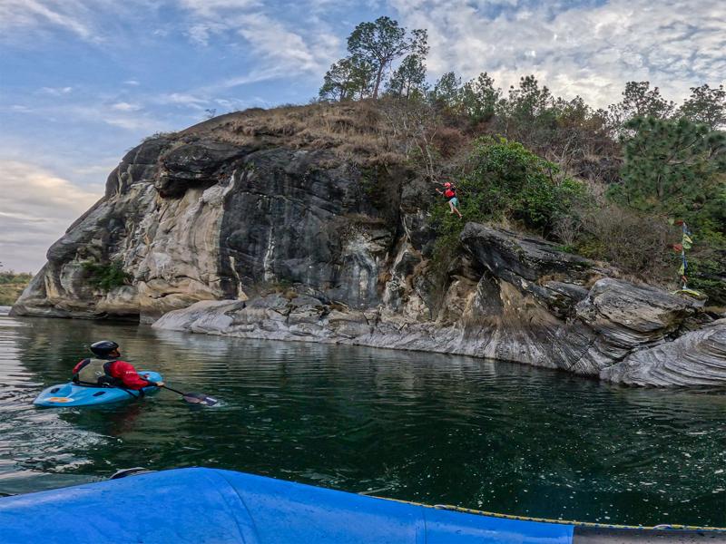Jumping off the rock cliff
