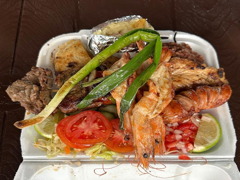Chicken, prawns and steak with rice, beans and tortillas - very good!