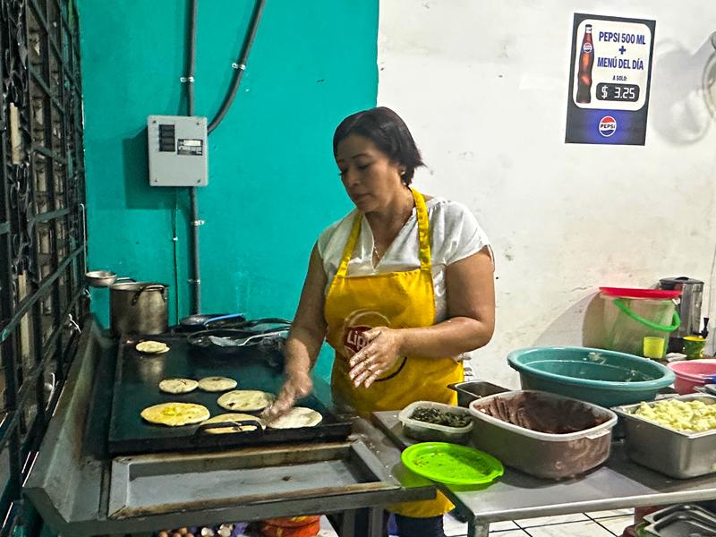 Woman making the pupusas