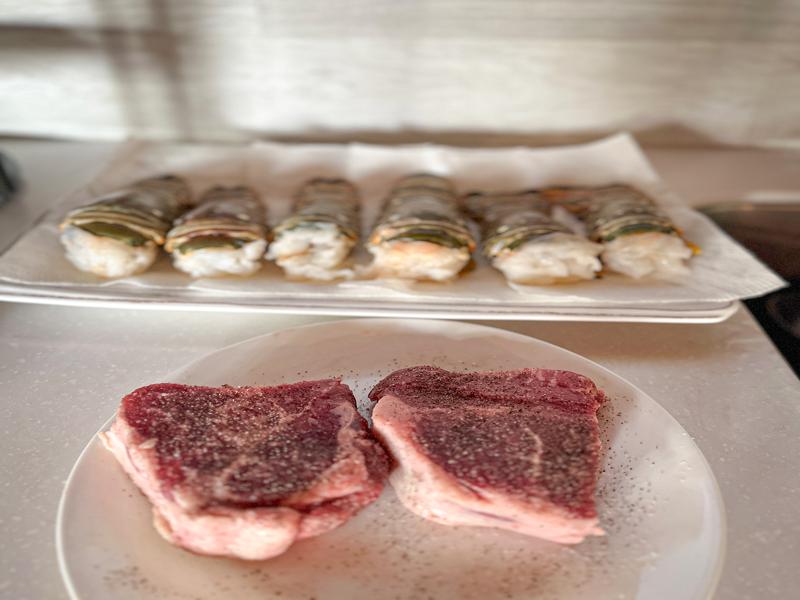 Preparing lobster and steak