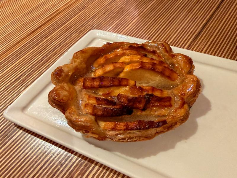 Trying the apple pastry