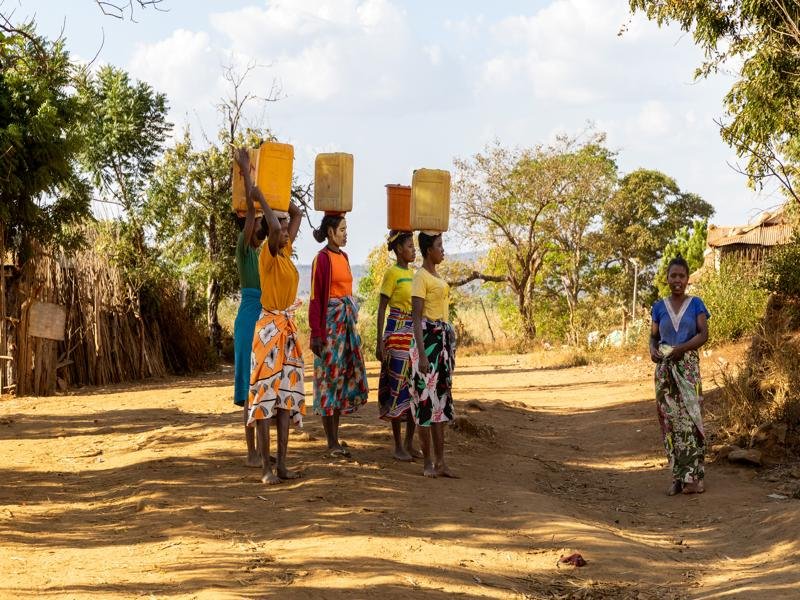 Women gathering water in the village where we would end our canoe trip