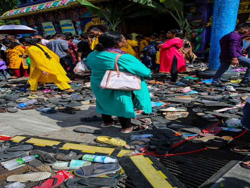 Piles of abandoned shoes heading into the temple