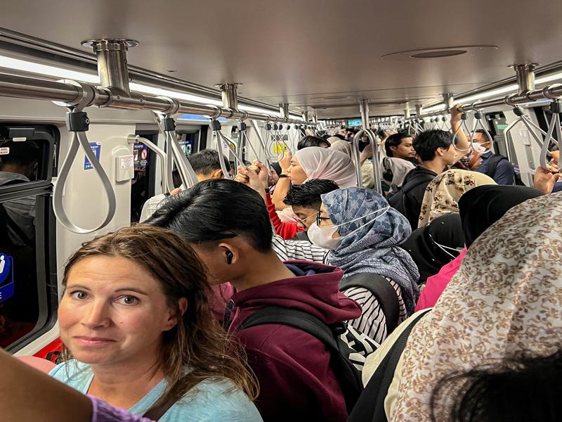 The metro was so crowded for weekday morning on way to the airport