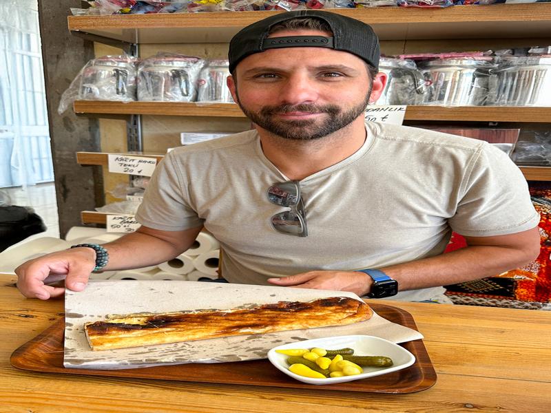 Trying the local cheese and meat sandwiches